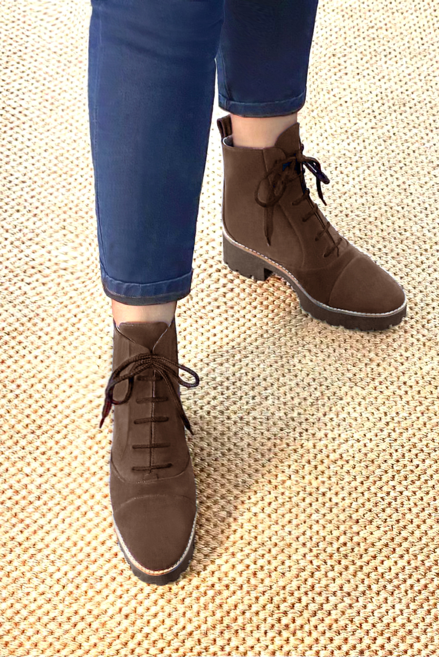 Chocolate brown women's ankle boots with laces at the front. Round toe. Low rubber soles. Worn view - Florence KOOIJMAN